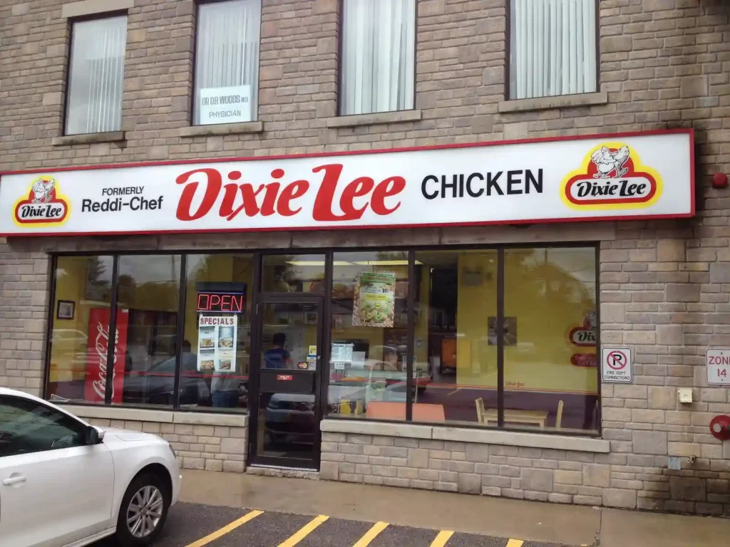 Dixie Lee Chicken storefront with signage and open sign.