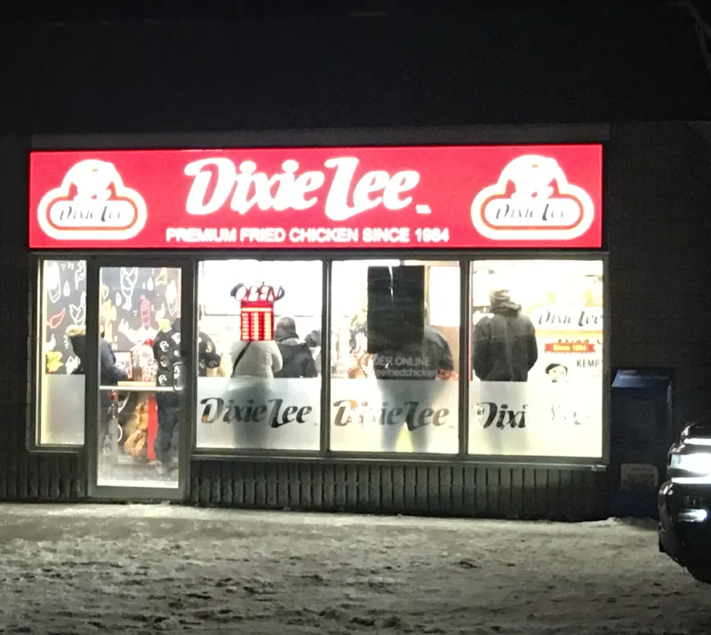Dixie Lee fried chicken restaurant exterior at night.